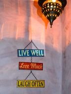 happy living vintage motivation signs on wall