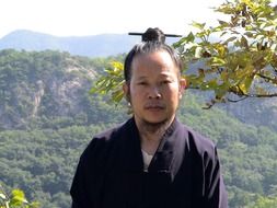 chinese monk, young man portrait outdoor