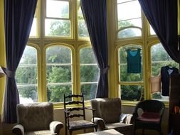 vintage living room interior with tall windows