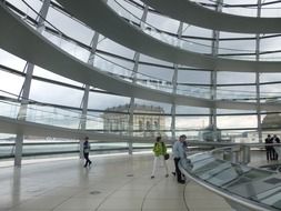 people at museum exposition in glass dome of reichstag, germany, berlin