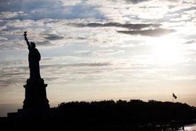 silhouette of liberty statue at evening sky, usa, manhattan, new york usa