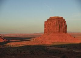 scenic landscape of rock formation in red desert at evening in usa, arizona, monument valley