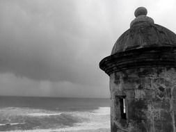 tower of medieval castle at sea under stormy clouds, uk, england, West Sussex, arundel