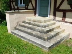 gradually stairs at entrance door of truss house