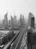 high rise buildings on street in city, uae, dubai