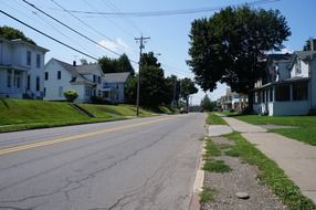 cracked asphalt road on street in countryside