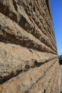 perspective of grooved granite wall