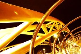 yellow metal constructions of bridge at night sky, spain, pontevedra