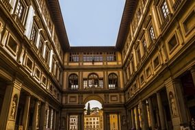 square among colorful ornamental city buildings in florence