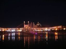 Shah Mosque mirroring on water at night, iran, Isfahan