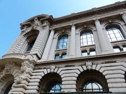 facade of old building with arched windows, france, monaco