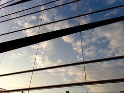 sky reflection on glass facade