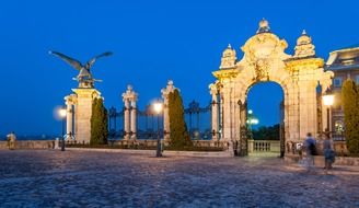 beautiful arched gateway to the Royal Palace at evening, hungary, budapest