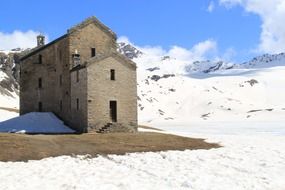 old rock building lake miserin champorcher mountain snow