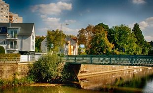 green bridge in city at fall, germany, frankfurt, hausen