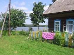old wooden village house at summer, russia