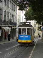 tram on old street in city, portugal