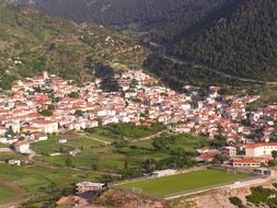 old village in valley at mountain side, greece, kyriaki