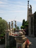 antique sculptures on terrace of palazzo borromeo, italy, Isola Bella