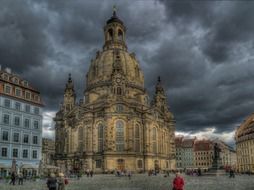 frauenkirche in city under stormy clouds, germany, dresden