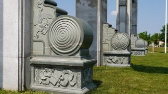 row of stone constructions with carved dragons, china