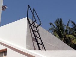 metal ladder on roof of building, india, dharwad