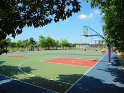 people on basketball court in city, china, haikou