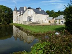 château de la Cour des Prés, moated fortress at summer, france, rumigny