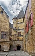 medieval building with gateway and turret, france, sarlat la caneda