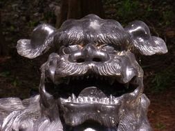 aged shiny chinese statue, dragon head, usa, new york, Canandaigua, sonnenberg gardens