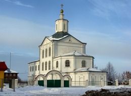 white orthodox church at winter in countryside in Russia
