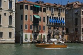 motor boat on grand canal in city, italy, venice