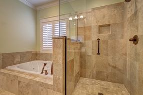 tile walls and floor in contemporary bathroom