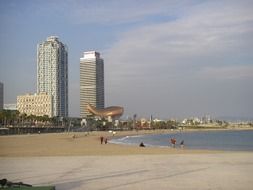 people on sea beach at city, spain, barcelona