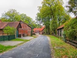 rural village buildings along road at fall in germany, stellichte