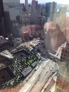 top view of National September 11 Memorial in downtown through window, usa, manhattan, nyc