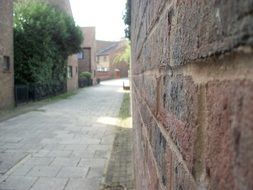 Urban street with brick walls in city