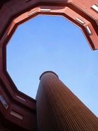 low angle view of red round facade of modern building, spain