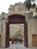 horse drawn carriage at aged wall, malta, mdina