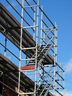 Scaffolding against the blue sky