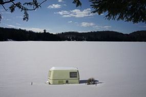 White trailer on frozen Snowy lake