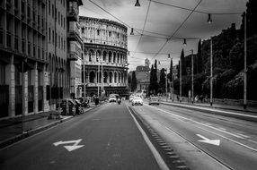 black and white view of colosseum rome city road