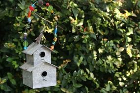 decorated two-storey birdhouse outdoor