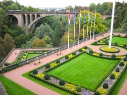 flags on beautiful square in front of Adolphe Bridge at autumn, luxembourg