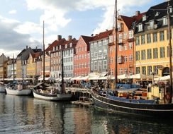 sailing boats mooring at waterfront in city, denmark, copenhagen