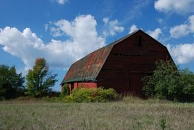 old red barn in summer countryside, canada