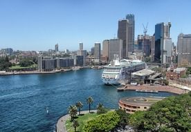 ocean liner at beautiful coastline with modern buildings, australia, sydney