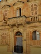 classic facade with arched windows and balustrades