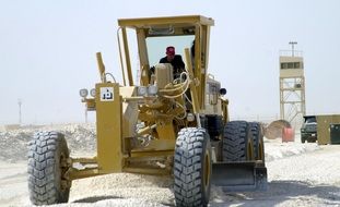 grader at work on road construction site