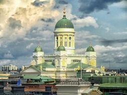 domes of Helsinki Lutheran Cathedral at dramatic sky with clouds, finland